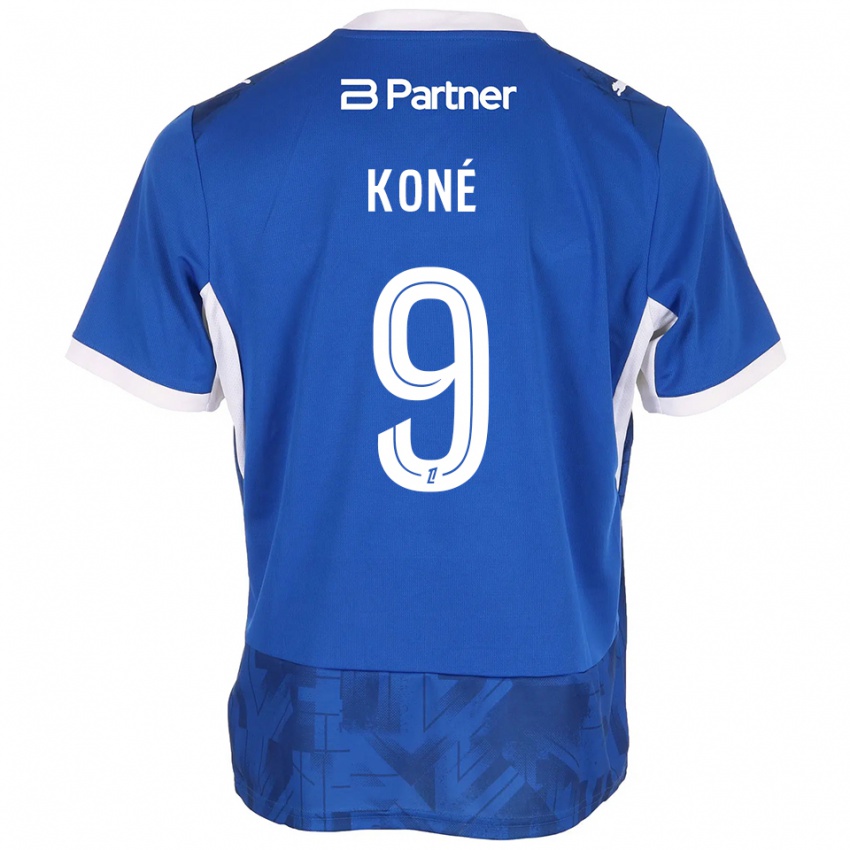 נשים Yacouba Koné #9 כחול בינוני לבן ג'רזי ביתית 2026/27 חולצה קצרה