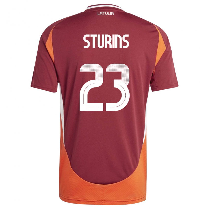 נשים לטביה Raivo Sturins #23 אדום עמוק לבן כתום ג'רזי ביתית 26-28 חולצה קצרה